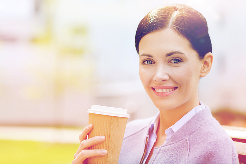 woman sipping sugary drink latte